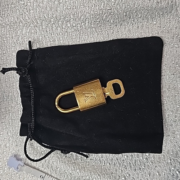 Louis Vuitton Other - Louis Vuitton lock and key #315 with small bag